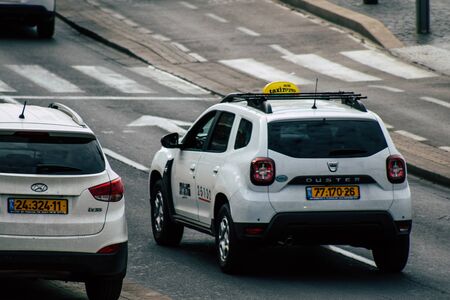 Tel Aviv Israel December 07, 2019 View of traditional Israeli taxi rolling in the streets of Tel Aviv in the afternoonの写真素材