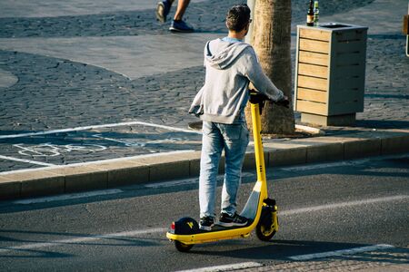 Tel Aviv Israel December 07, 2019 View of unknown Israeli people rolling with a electric scooter in...
