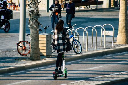 Tel Aviv Israel December 07, 2019 View of unknown Israeli people rolling with a electric scooter in...