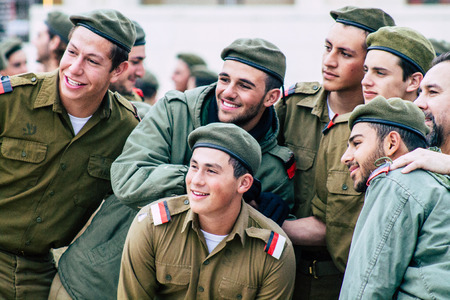 Jerusalem Israel December 11, 2019 View of Israeli soldiers having fun front the Western Wall of the old city of Jerusalem on the eveningのeditorial素材