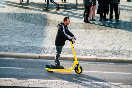 Tel Aviv Israel December 07, 2019 View of unknown Israeli people rolling with a electric scooter in the streets of Tel Aviv in the afternoonのeditorial素材