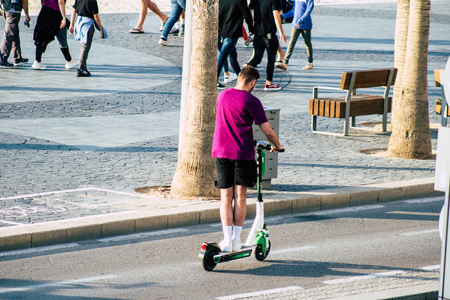 Tel Aviv Israel December 07, 2019 View of unknown Israeli people rolling with a electric scooter in...