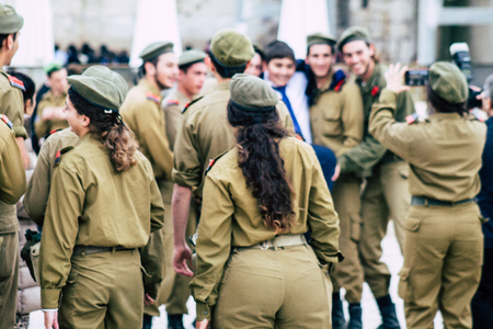 Jerusalem Israel December 11, 2019 View of Israeli soldiers standing front the Western Wall of the old city of Jerusalem on the eveningのeditorial素材