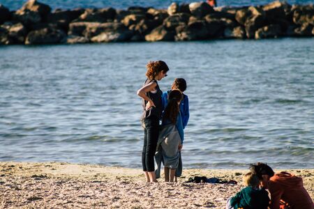 Tel Aviv Israel December 22, 2019 View of unidentified people having fun on the beach of Tel Aviv in the afternoonの写真素材
