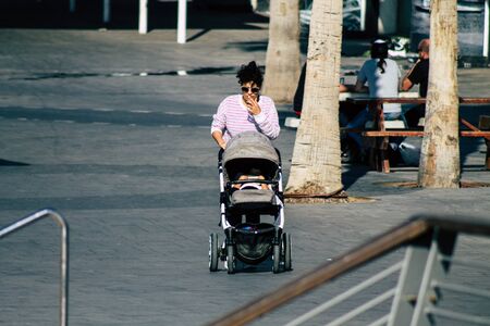 Tel Aviv Israel December 22, 2019 View of unidentified people walking on Herbert Samuel Promenade in Tel Aviv in the afternoonの写真素材