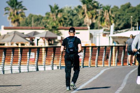 Tel Aviv Israel December 22, 2019 View of unidentified people walking on Herbert Samuel Promenade in Tel Aviv in the afternoonの写真素材