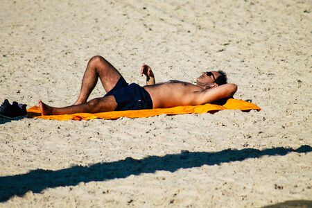 Tel Aviv Israel December 22, 2019 View of unidentified people having fun on the beach of Tel Aviv in the afternoonの写真素材
