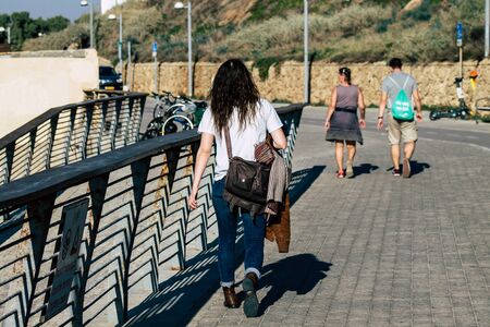 Tel Aviv Israel December 22, 2019 View of unidentified people walking on Herbert Samuel Promenade in Tel Aviv in the afternoonの写真素材