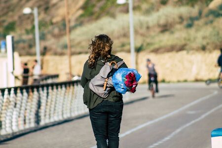 Tel Aviv Israel December 22, 2019 View of unidentified people rolling with a electric scooter in the streets of Tel Aviv in the afternoonの写真素材