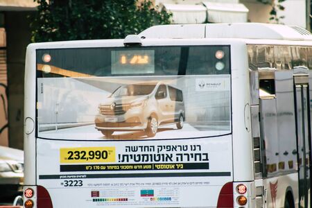 Tel Aviv Israel December 23, 2019 View of a traditional Israeli public city bus rolling in the streets of Tel Aviv in in the afternoonの写真素材
