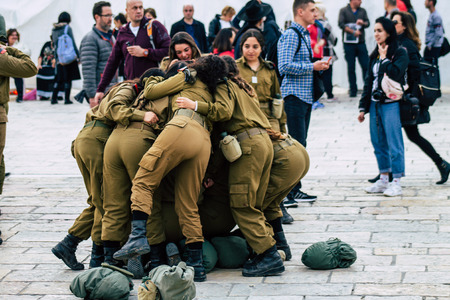 Jerusalem Israel December 11, 2019 View of Israeli soldiers having fun front the Western Wall of the old city of Jerusalem on the eveningのeditorial素材