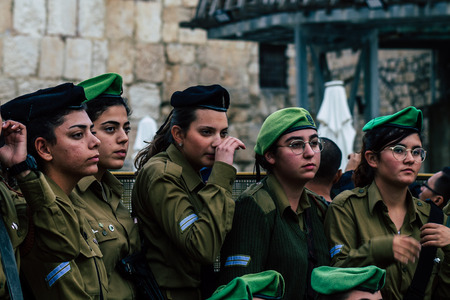 Jerusalem Israel December 11, 2019 View of Israeli soldiers having fun front the Western Wall of the old city of Jerusalem on the eveningのeditorial素材