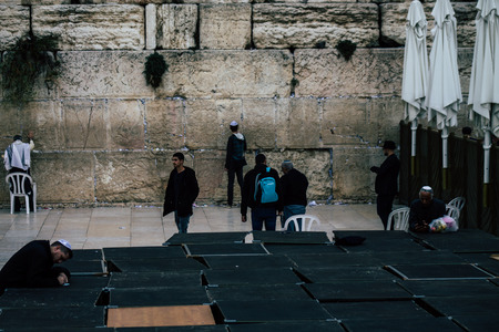 Jerusalem Israel December 11, 2019 View of unknowns people praying front the Western Wall at the Old city of Jerusalem in the morningのeditorial素材