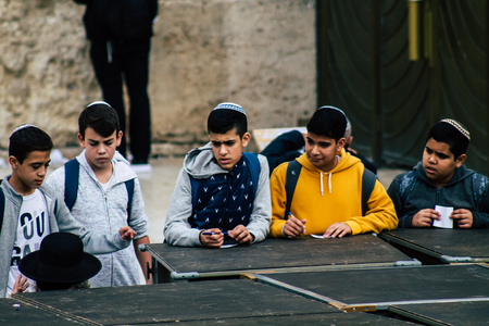 Jerusalem Israel December 11, 2019 View of unknowns people praying front the Western Wall at the Old city of Jerusalem in the morningのeditorial素材
