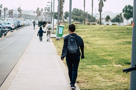 Tel Aviv Israel December 25, 2019 View of unidentified people walking on Herbert Samuel Promenade in Tel Aviv in the afternoonの写真素材