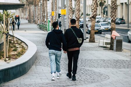 Tel Aviv Israel December 25, 2019 View of unidentified people walking on Herbert Samuel Promenade in Tel Aviv in the afternoonの写真素材