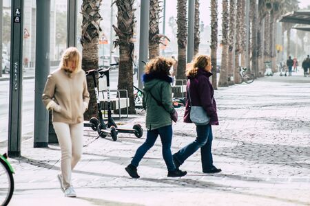 Tel Aviv Israel December 25, 2019 View of unidentified people walking on Herbert Samuel Promenade in Tel Aviv in the afternoonの写真素材