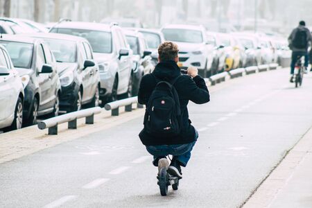 Tel Aviv Israel December 25, 2019 View of unidentified people rolling with a electric scooter in the streets of Tel Aviv in the afternoonの写真素材
