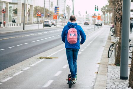 Tel Aviv Israel December 25, 2019 View of unidentified people rolling with a electric scooter in the streets of Tel Aviv in the afternoonの写真素材