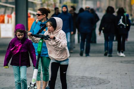 Tel Aviv Israel December 25, 2019 View of unidentified people rolling with a electric scooter in the streets of Tel Aviv in the afternoonのeditorial素材