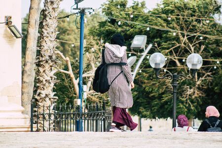 Tel Aviv Israel December 25, 2019 View of unidentified Muslim teen walking in the streets of Jaffa, the southern and oldest part of Tel Aviv in the afternoonのeditorial素材