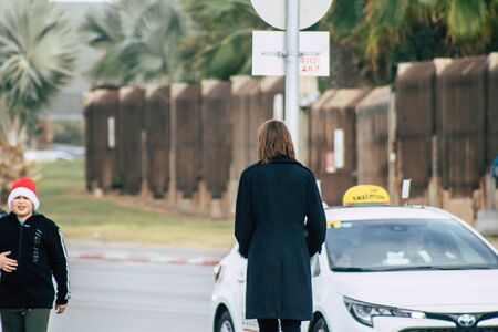 Tel Aviv Israel December 25, 2019 View of unidentified people rolling with a electric scooter in the streets of Tel Aviv in the afternoonのeditorial素材