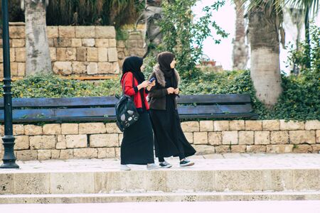 Tel Aviv Israel December 25, 2019 View of unidentified Muslim teen walking in the streets of Jaffa, the southern and oldest part of Tel Aviv in the afternoonのeditorial素材