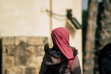 Tel Aviv Israel December 25, 2019 View of unidentified Muslim teen walking in the streets of Jaffa, the southern and oldest part of Tel Aviv in the afternoonのeditorial素材