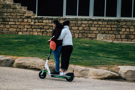 Tel Aviv Israel December 25, 2019 View of unidentified people rolling with a electric scooter in the streets of Tel Aviv in the afternoonのeditorial素材