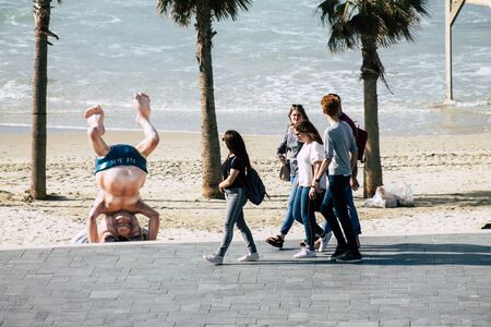 Tel Aviv Israel December 31, 2019 View of unidentified people walking on Herbert Samuel Promenade in Tel Aviv in the afternoonの写真素材