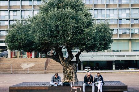 Tel Aviv Israel December 30, 2019 View of unidentified people crossing Rabin Square, a large public city square in the center of Tel Aviv in the afternoonのeditorial素材