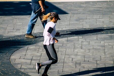 Tel Aviv Israel January 06, 2020 View of unidentified people running on Herbert Samuel Promenade in Tel Aviv in winterの写真素材