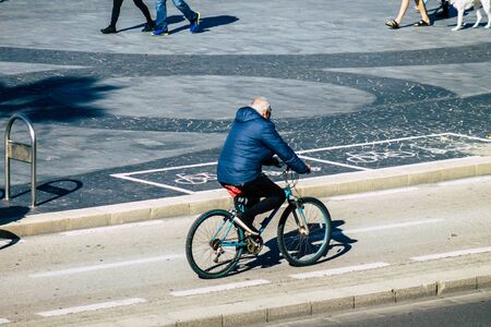 Tel Aviv Israel January 06, 2020 View of unidentified people rolling with a bicycle in the streets...