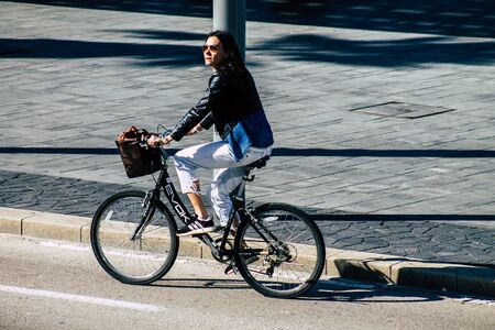 Tel Aviv Israel January 06, 2020 View of unidentified people rolling with a bicycle in the streets of Tel Aviv in winterのeditorial素材