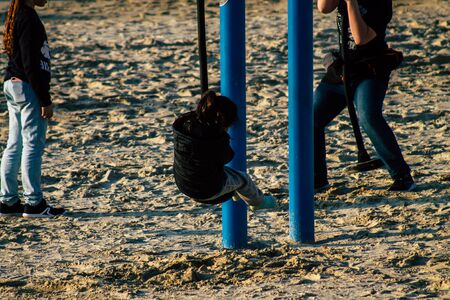 Tel Aviv Israel January 10, 2020 View of unidentified Israeli kid having fun on the beach of Tel Aviv during a sunny day in winterの写真素材