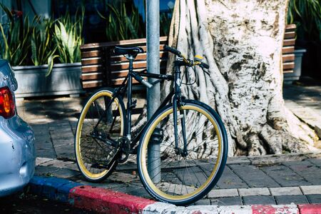 Tel Aviv Israel January 10, 2020 Closeup of a bicycle parked in the streets of Tel Aviv in the morningの写真素材