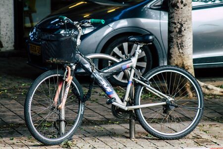 Tel Aviv Israel January 10, 2020 Closeup of a bicycle parked in the streets of Tel Aviv in the morningの写真素材