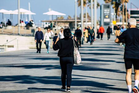 Tel Aviv Israel January 11, 2020 View of unidentified people walking on Herbert Samuel Promenade in Tel Aviv in the afternoonの写真素材