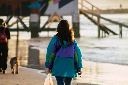 Tel Aviv Israel January 10, 2020 View of unidentified Israeli people having fun on the beach of Tel Aviv during a sunny day in winterの写真素材