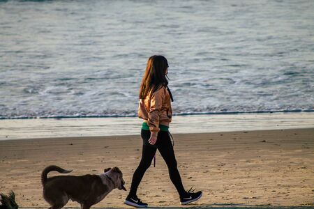 Tel Aviv Israel January 10, 2020 View of unidentified Israeli people having fun on the beach of Tel Aviv during a sunny day in winterの写真素材