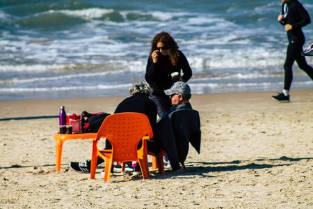 Tel Aviv Israel January 11, 2020 View of unidentified people having fun on the beach of Tel Aviv in winterの写真素材