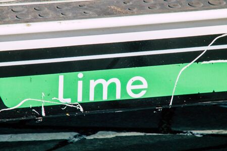 Tel Aviv Israel January 11, 2020 View of a Lime brand electric scooter parked in the streets of Tel Aviv in winterの写真素材