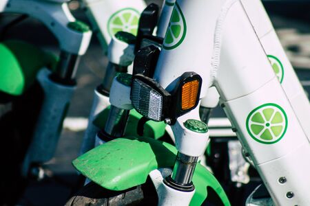 Tel Aviv Israel January 11, 2020 View of a Lime brand electric scooter parked in the streets of Tel Aviv in winterの写真素材