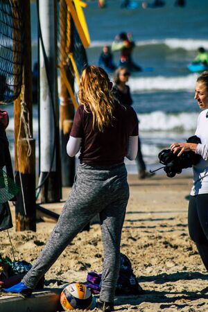 Tel Aviv Israel January 11, 2020 View of unidentified people having fun on the beach of Tel Aviv in winterの写真素材