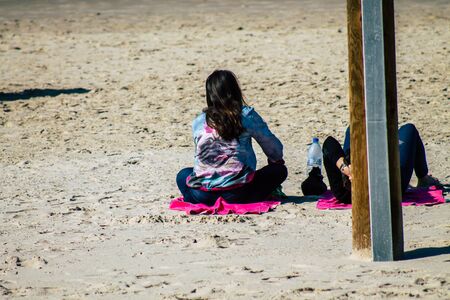 Tel Aviv Israel January 11, 2020 View of unidentified people having fun on the beach of Tel Aviv in winterの写真素材