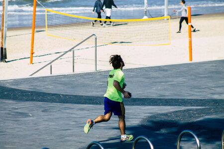 Tel Aviv Israel January 11, 2020 View of unidentified people running on Herbert Samuel Promenade in Tel Aviv in winterのeditorial素材