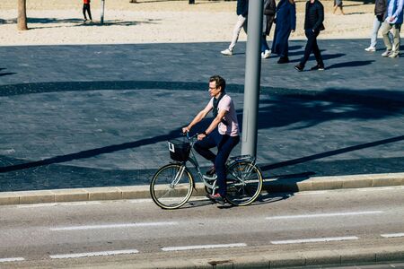 Tel Aviv Israel January 11, 2020 View of unidentified people rolling with a bicycle in the streets of Tel Aviv in winterの写真素材