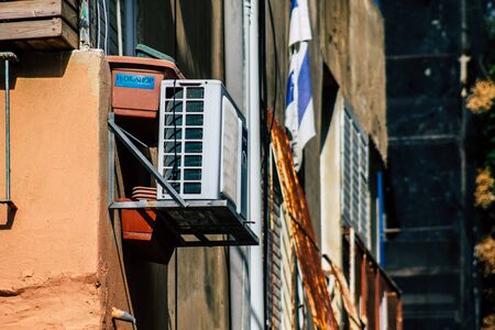 Tel Aviv Israel January 23, 2020 View of a unit air conditioning on a facade of a building in the streets of Tel Aviv in the afternoonの写真素材