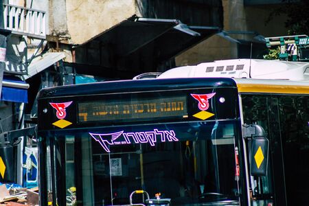 Tel Aviv Israel January 23, 2020 View of a traditional Israeli public city bus rolling in the streets of Tel Aviv in in the afternoonの写真素材