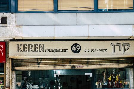 Tel Aviv Israel January 23, 2020 View of commercial sign on the facade of a building in the streets of Tel Aviv in the afternoonの写真素材
